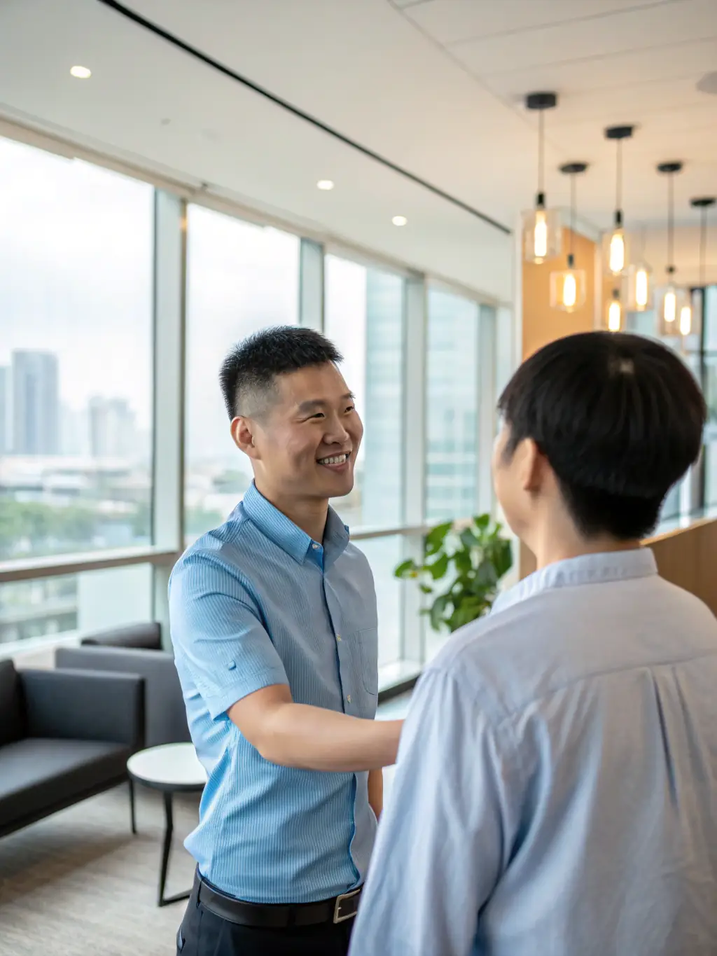 A successful employee being welcomed into a company, representing the positive impact of effective recruitment.